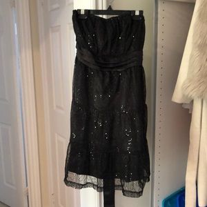 Black sequinned strapless dress. Petites.